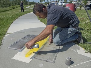 'Love letters to the world' etched into community's sidewalks