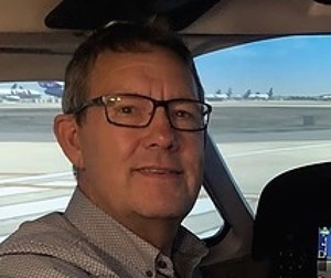 La Crete pilot stays behind to update evacuees with wildfire photos