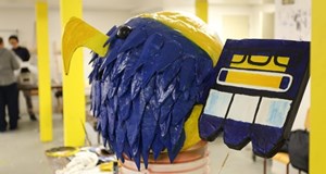 Young Indigenous artists paint their stories on big paper heads